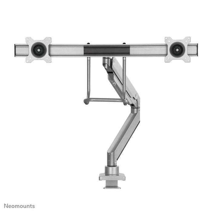 A Neomounts NM-D775DX ezüst egy gázrugós asztali tartó keresztléc és kar segítségével legfeljebb 32 hüvelykes (81 cm) lapos képernyőkhöz.