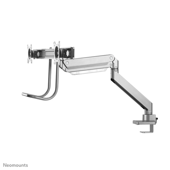 A Neomounts NM-D775DX ezüst egy gázrugós asztali tartó keresztléc és kar segítségével legfeljebb 32 hüvelykes (81 cm) lapos képernyőkhöz.